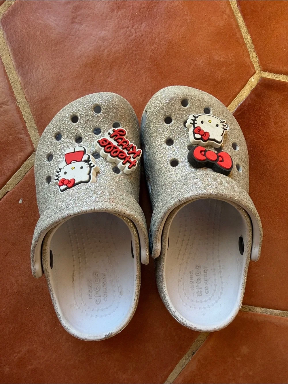Hello Kitty Glitter crocs in Silver with Red Accents